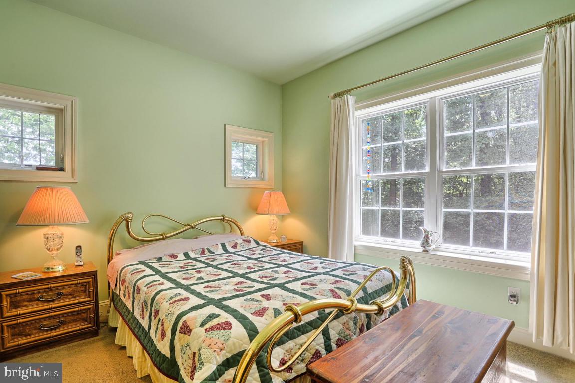 369 Nottingham Road Quarryville, PA 17566 - Photo 38 of 57 a bedroom with a bed and wooden floor
