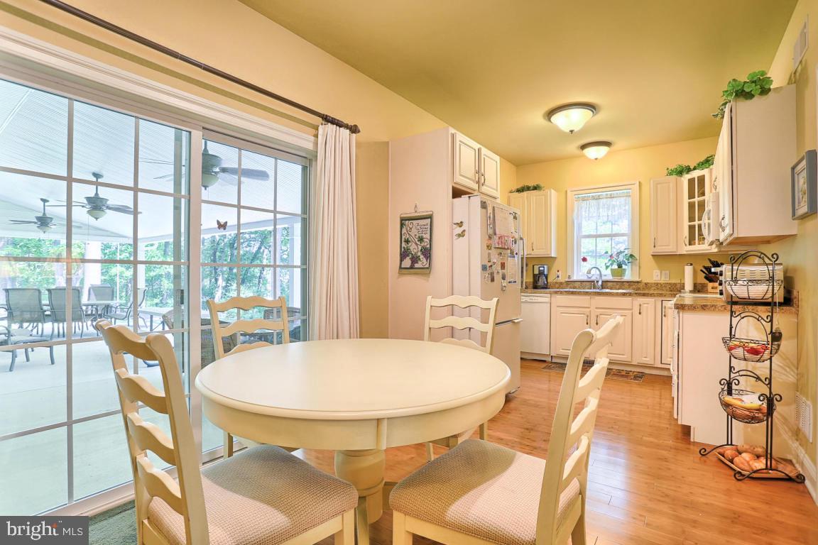 369 Nottingham Road Quarryville, PA 17566 - Photo 40 of 57 a view of a dining room with furniture window and wooden floor