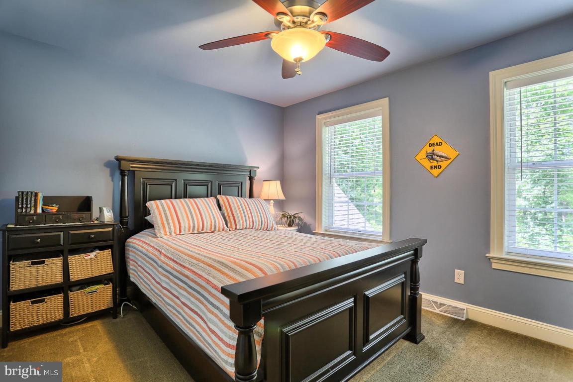 369 Nottingham Road Quarryville, PA 17566 - Photo 45 of 57 a bedroom with a bed and a chandelier