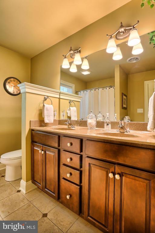 369 Nottingham Road Quarryville, PA 17566 - Photo 50 of 57 a bathroom with a sink mirror and a toilet