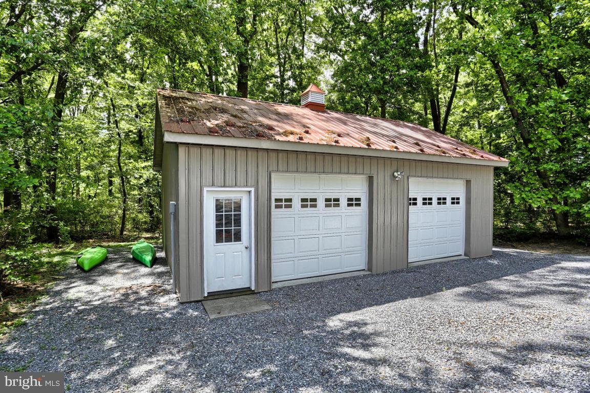 369 Nottingham Road Quarryville, PA 17566 - Photo 6 of 57 a front view of a house with a garden and yard