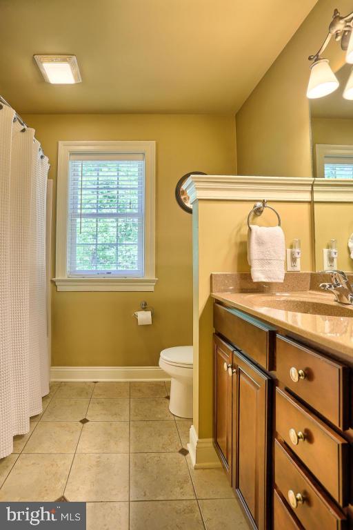 369 Nottingham Road Quarryville, PA 17566 - Photo 51 of 57 a bathroom with a granite countertop sink toilet and a mirror