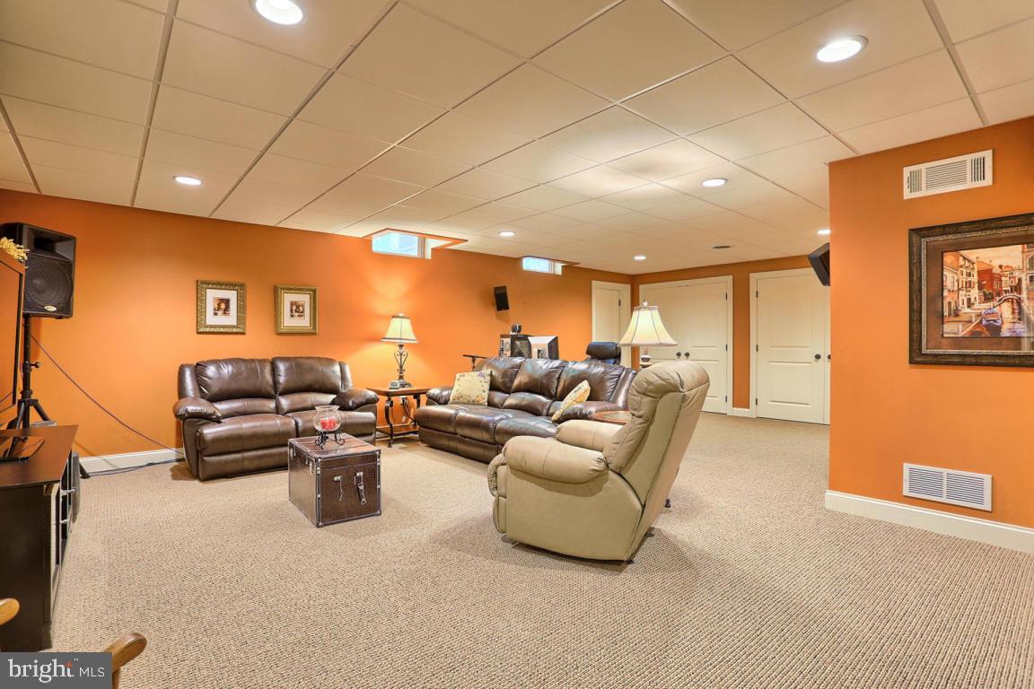 369 Nottingham Road Quarryville, PA 17566 - Photo 54 of 57 a living room with furniture and a flat screen tv