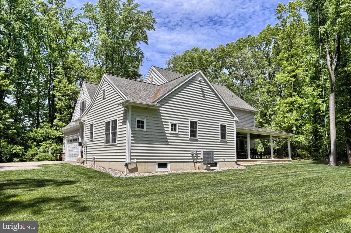 369 Nottingham Road Quarryville, PA 17566 - Photo 10 of 57 a front view of a house with a garden