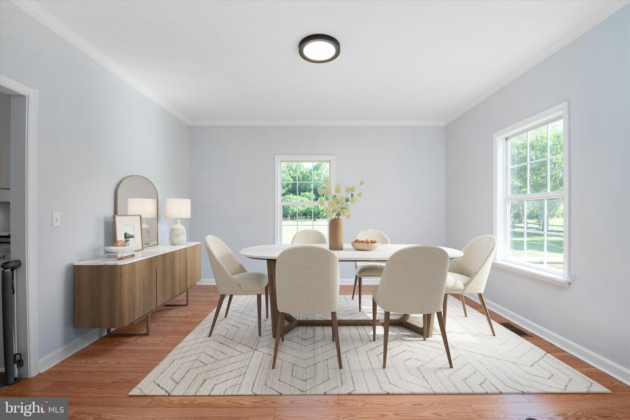 913 Clark Corner Road Centreville, MD 21617 - Photo 20 of 66 a view of a dining room with furniture window and wooden floor