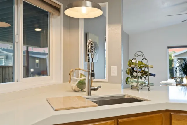 a kitchen with sink cabinets and wooden floor
