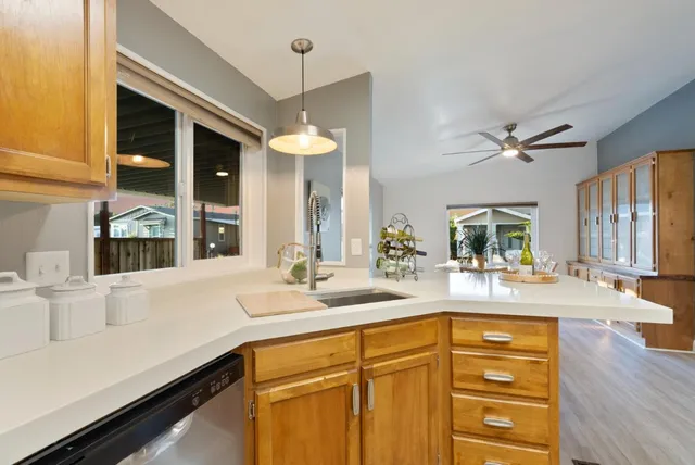 a bathroom with a sink vanity and mirror