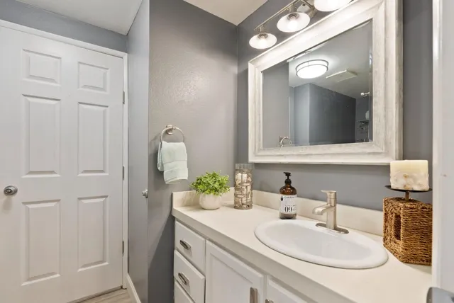 a white toilet sitting next to a shower