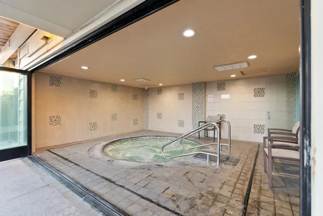 an aerial view of a city and ocean view