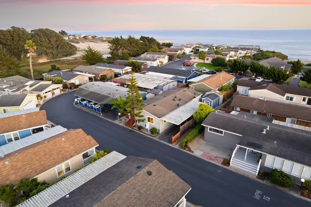 a dining room with lots of wooden furniture