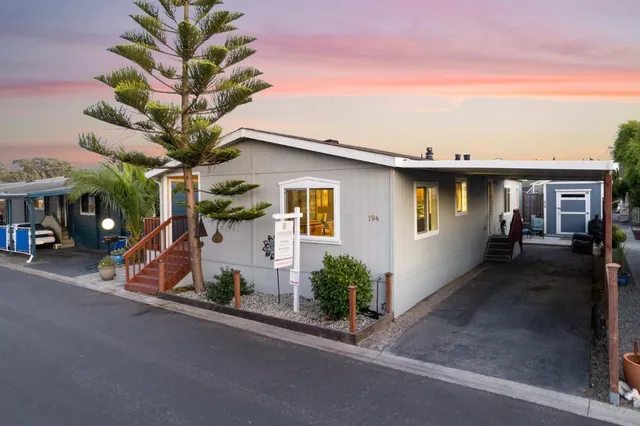 a dining room with furniture window and wooden floor