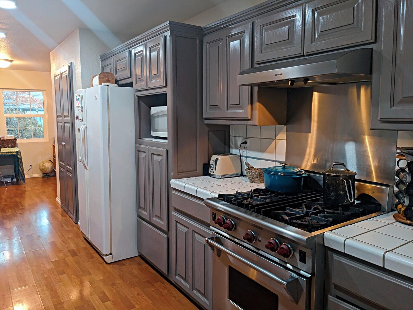29276 Bullskin Ridge Road Oak Run, CA 96069 - Photo 20 of 113 a kitchen with stainless steel appliances granite countertop a stove and a refrigerator