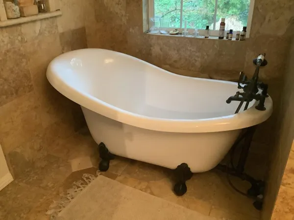 a living room with furniture and a flat screen tv with wooden floor