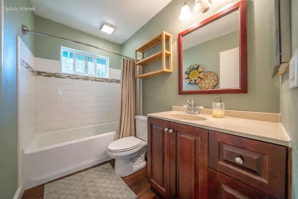 a backyard of a house with table and chairs