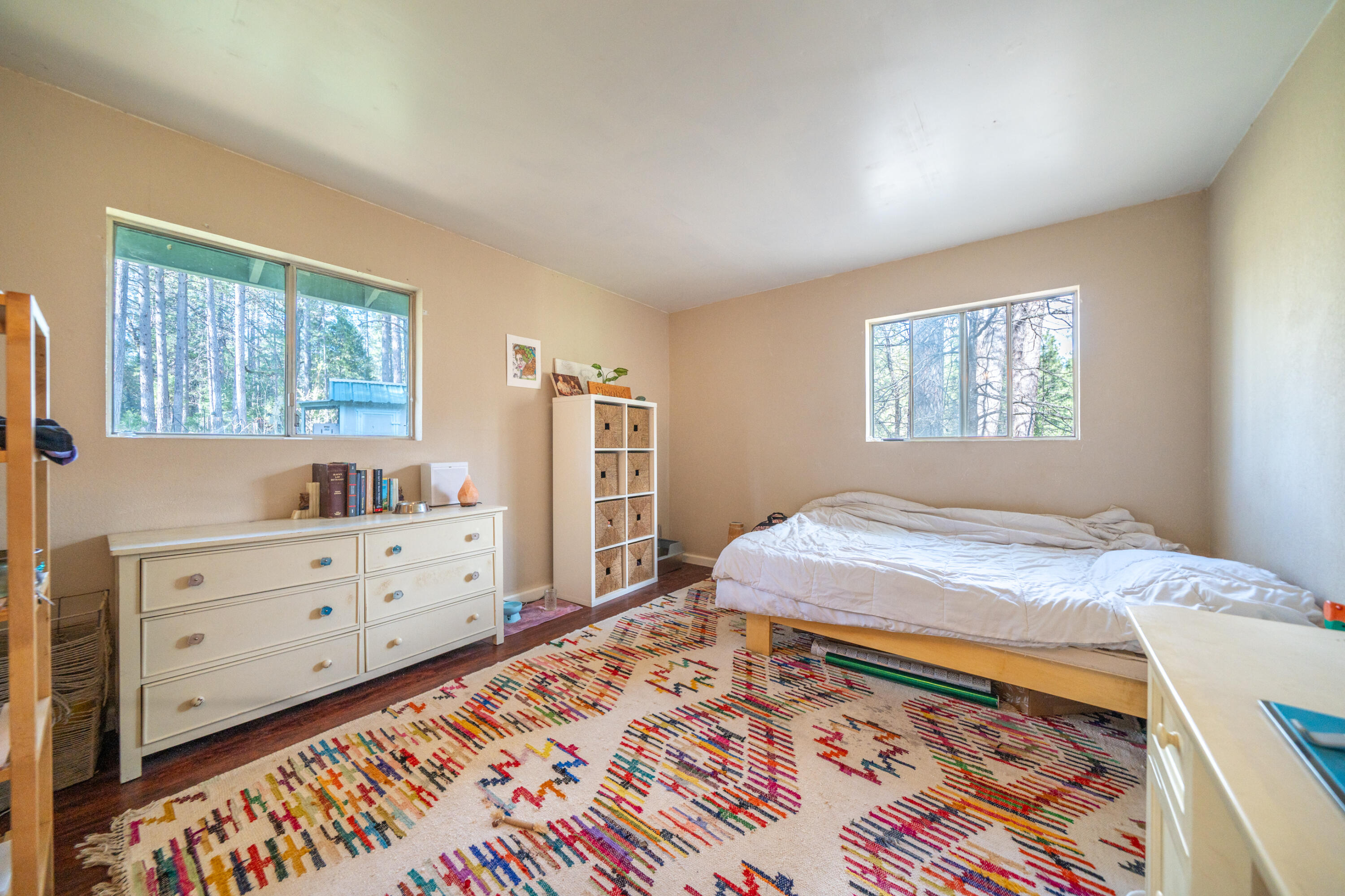 29276 Bullskin Ridge Road Oak Run, CA 96069 - Photo 42 of 113 a bed room with a bed and a dresser