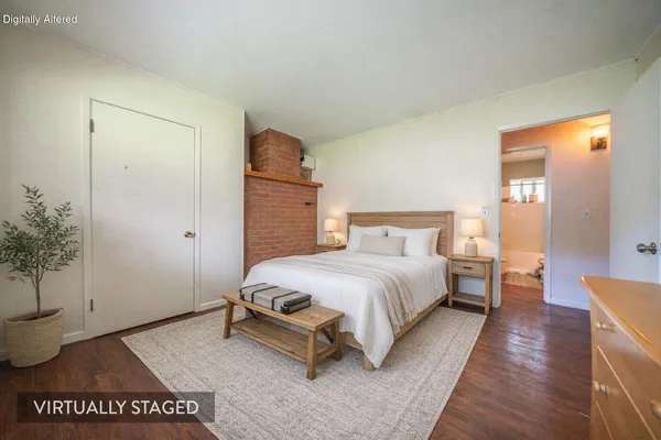 an aerial view of a house with a yard and lake view