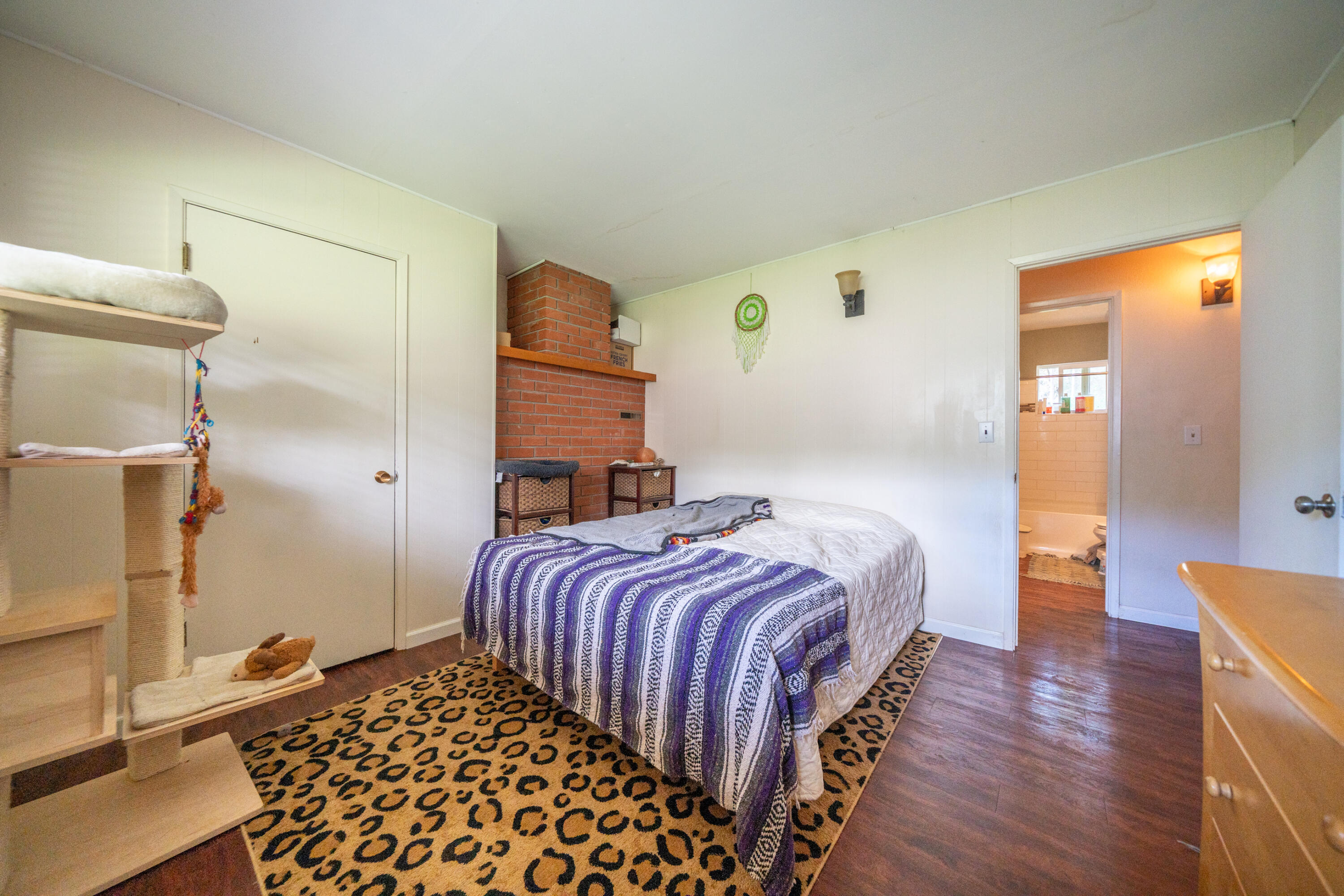 29276 Bullskin Ridge Road Oak Run, CA 96069 - Photo 46 of 113 a bedroom with a bed and wooden floor