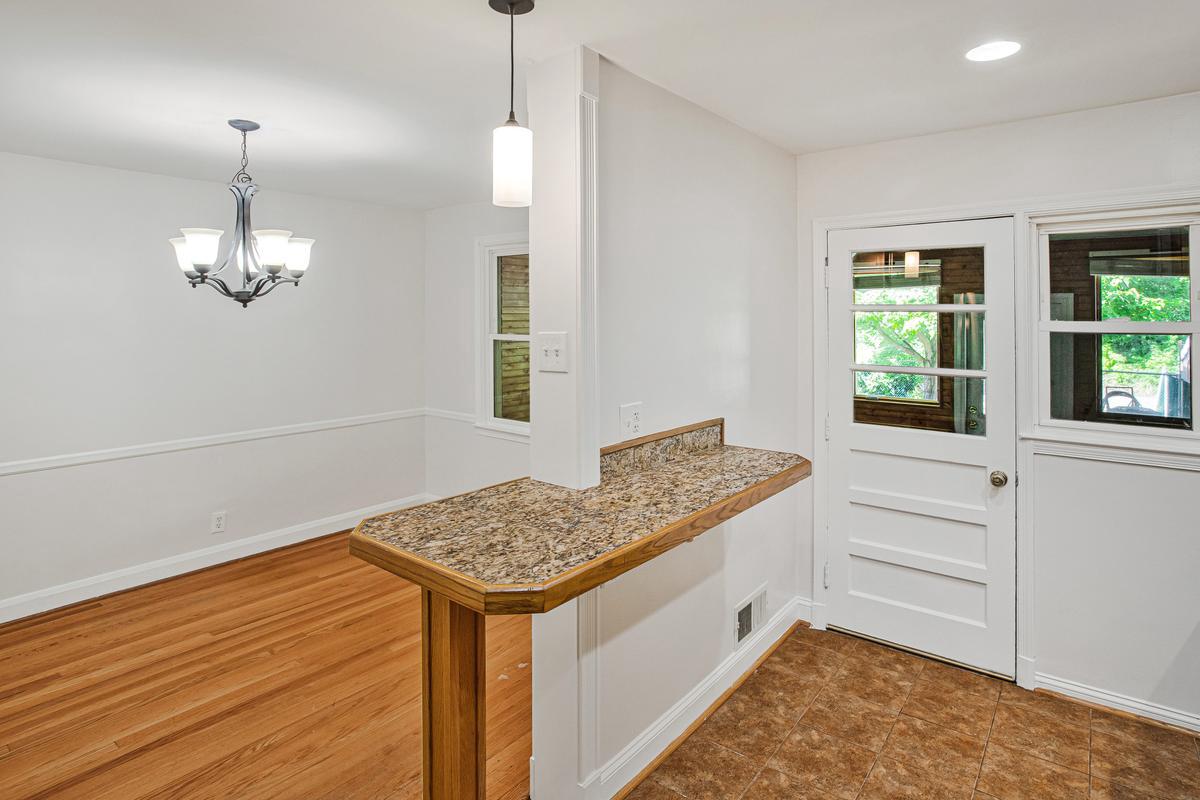 1016 Winsford Road Towson, MD 21204 - Photo 14 of 42 a kitchen that has a lot of cabinets in it