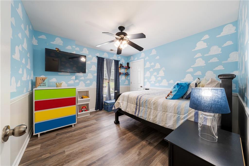 55 Meridian Point Dallas, GA 30132 - Photo 23 of 45 a bedroom with a bed and a flat screen tv