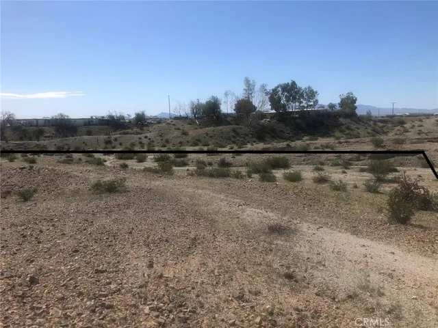 a view of lake with houses in the back