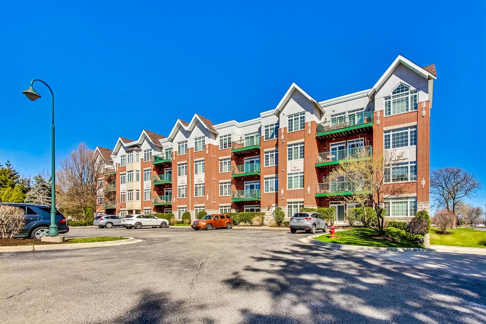 620 McHenry Road, Unit 407 Wheeling, IL 60090 - Photo 1 of 23 a view of a street with buildings