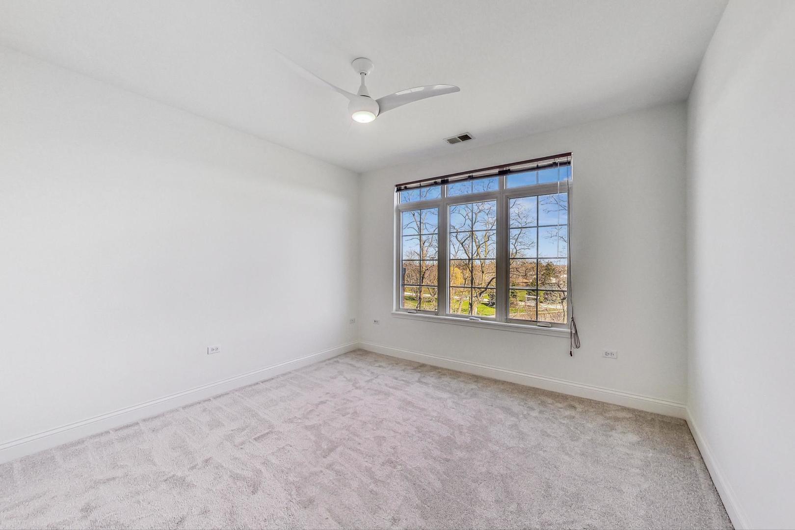 620 McHenry Road, Unit 407 Wheeling, IL 60090 - Photo 15 of 23 an empty room with a window