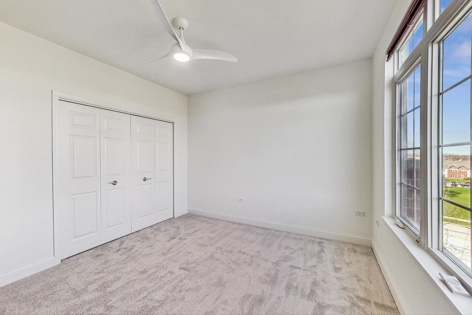 620 McHenry Road, Unit 407 Wheeling, IL 60090 - Photo 16 of 23 a view of an empty room with a window