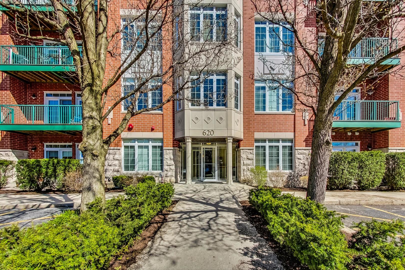 620 McHenry Road, Unit 407 Wheeling, IL 60090 - Photo 2 of 23 front view of a building