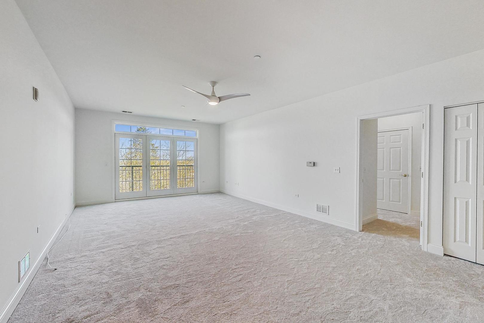 620 McHenry Road, Unit 407 Wheeling, IL 60090 - Photo 5 of 23 a view of an empty room with a window