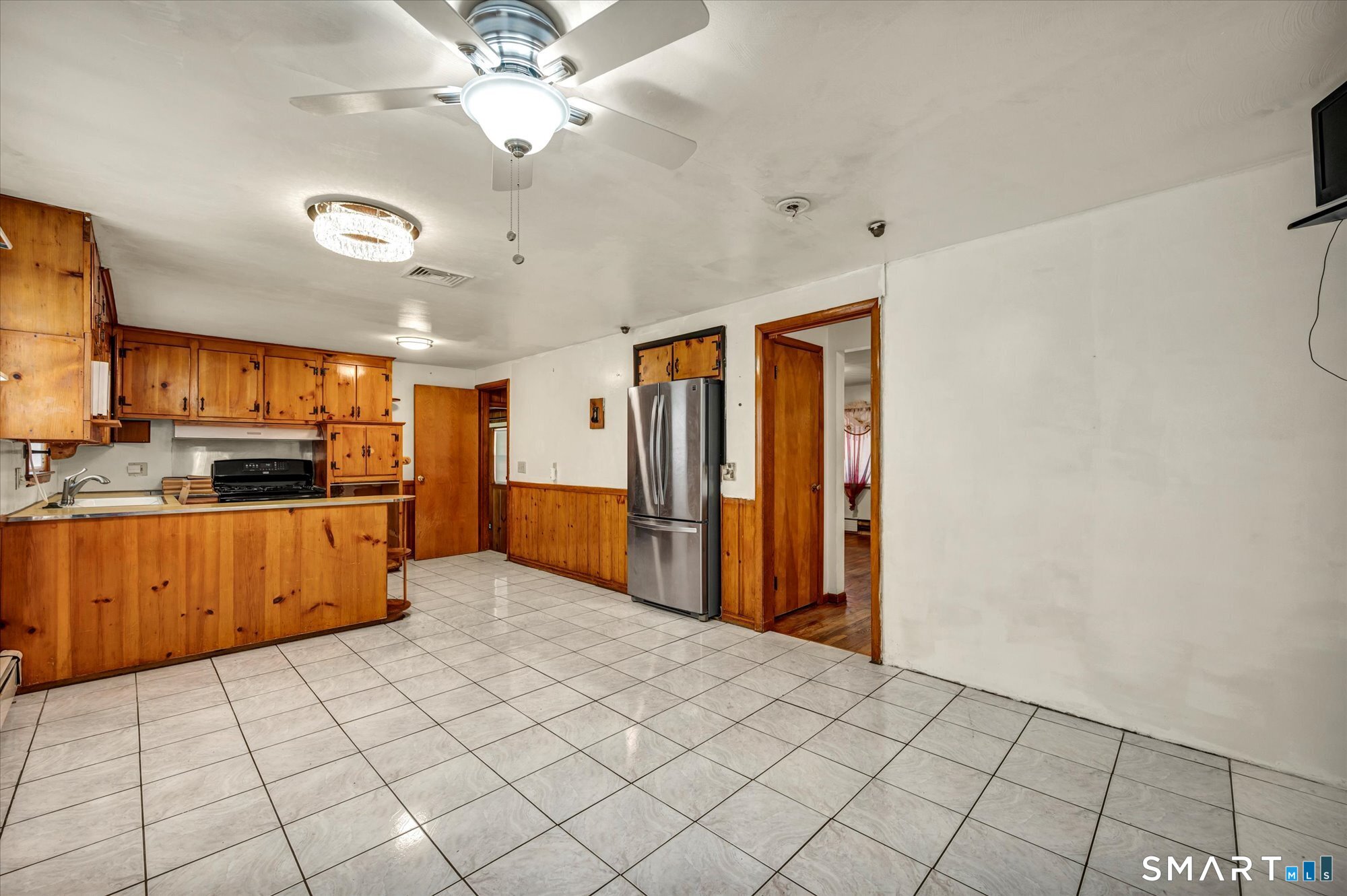 740 Rainbow Road Windsor, CT 06095 - Photo 17 of 40 a kitchen with stainless steel appliances a refrigerator and microwave
