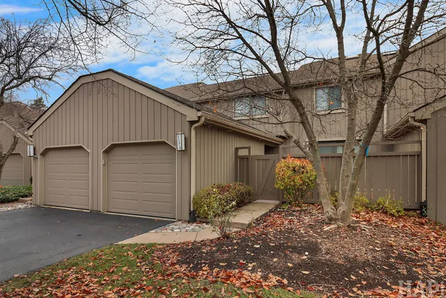 a view of a house with a yard and garage
