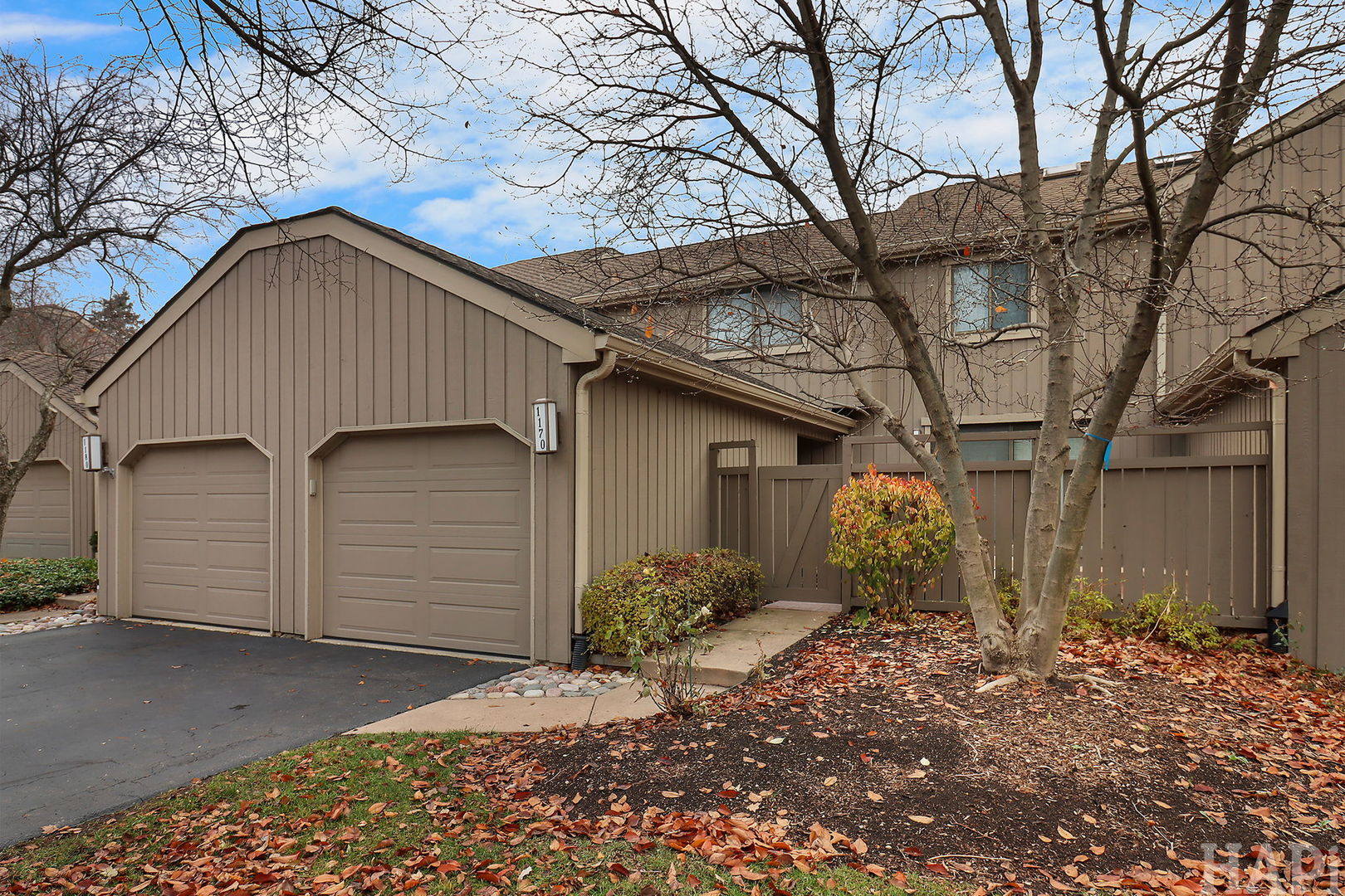 a view of a house with a yard and garage
