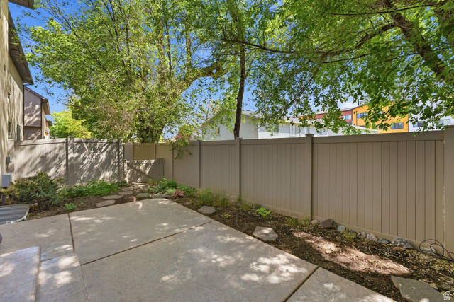 7235 Viansa Court Midvale, UT 84047 - Photo 37 of 43 Fenced backyard with a patio area