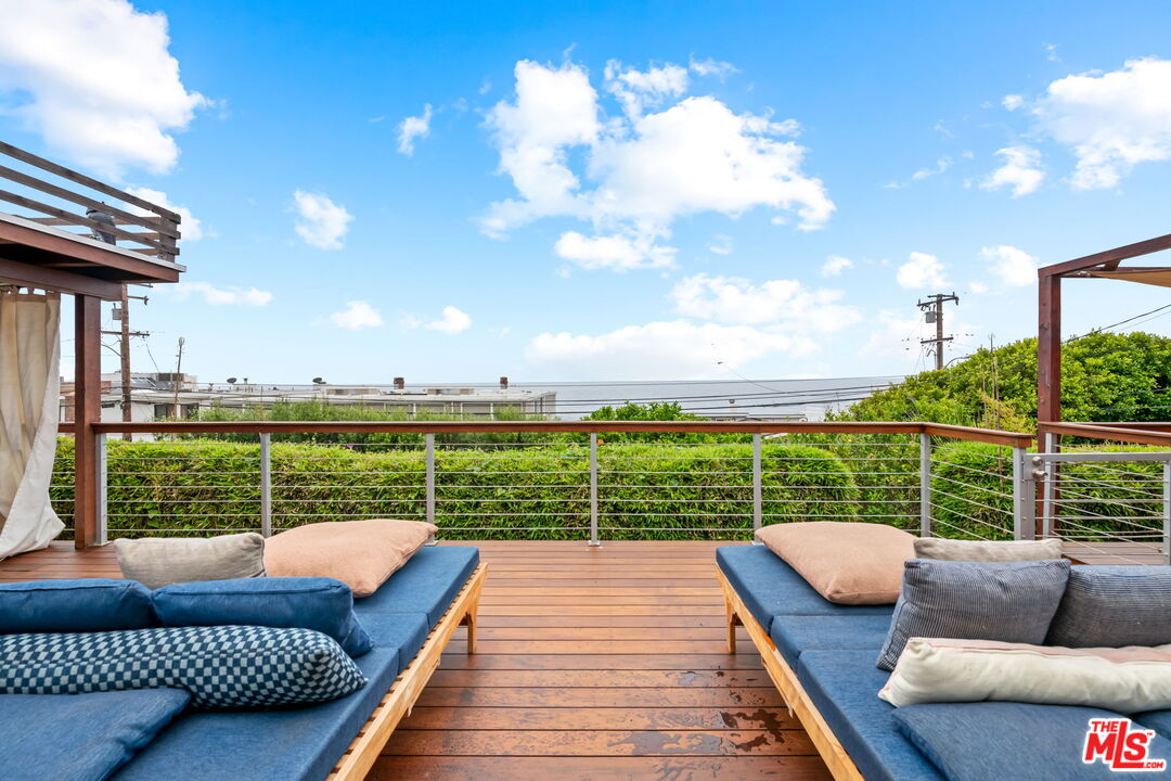 a view of a roof deck with couches