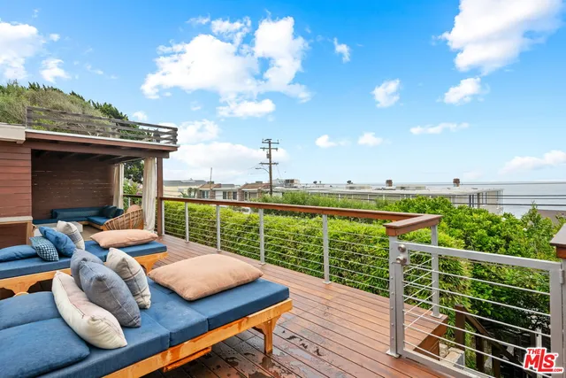 a view of a roof deck with couches