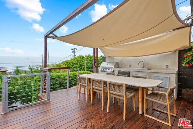 a patio with table and chairs