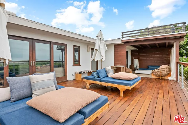 a outdoor space with furniture and wooden floor