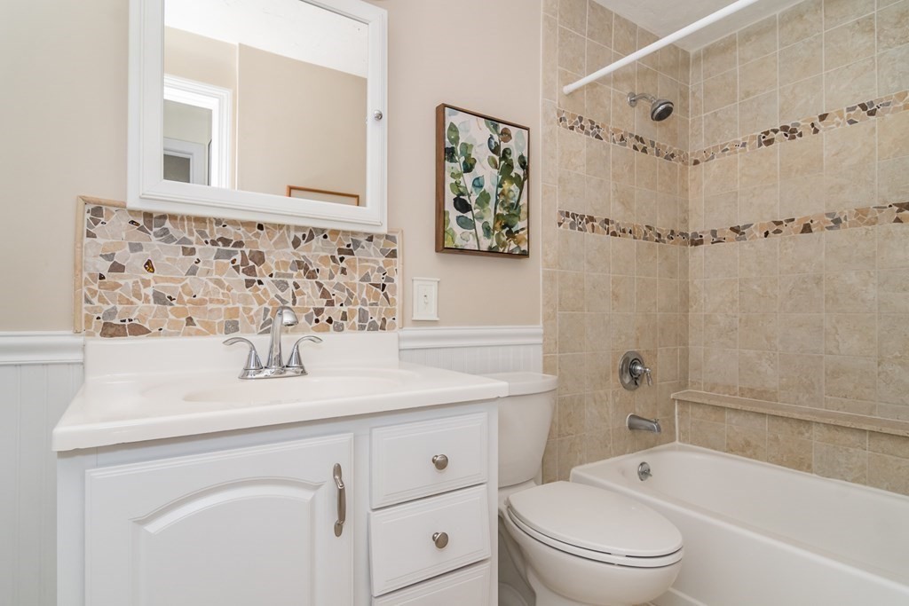 30 Walden Drive, Unit 7 Natick, MA 01760 - Photo 11 of 18 a bathroom with a sink a toilet and a bathtub