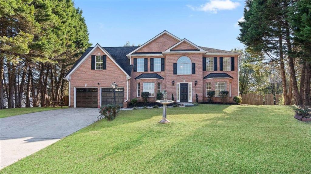 2170 Trickle Creek Court Decatur, GA 30035 - Photo 1 of 1 a front view of a house with a yard