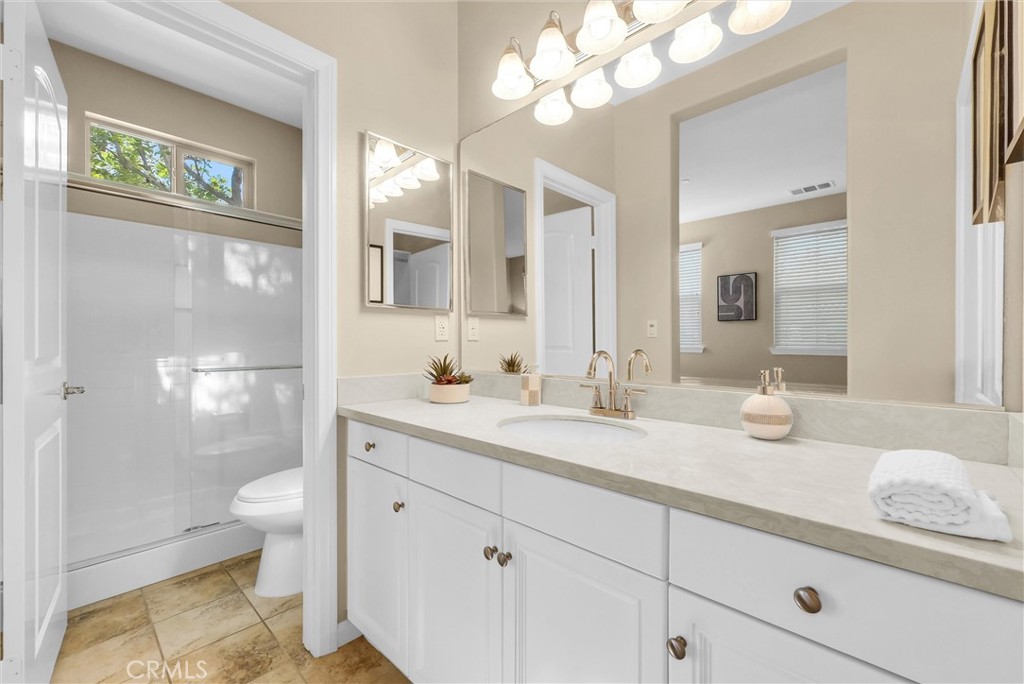 3515 Gardenia Lane Brea, CA 92823 - Photo 13 of 46 a bathroom with a granite countertop double vanity sink mirror and toilet