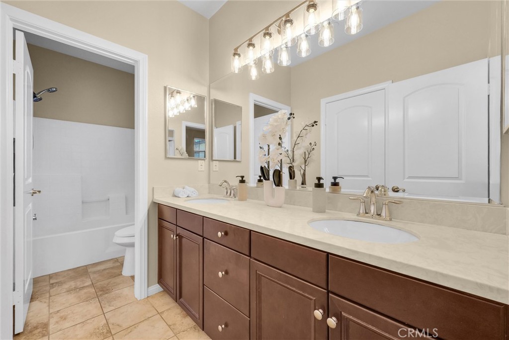 3515 Gardenia Lane Brea, CA 92823 - Photo 18 of 46 a bathroom with a sink double vanity granite tub and shower