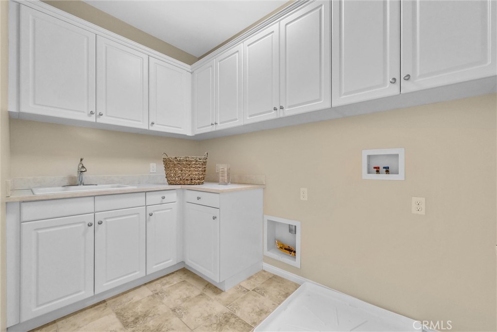 3515 Gardenia Lane Brea, CA 92823 - Photo 21 of 46 a kitchen with white cabinets and sink