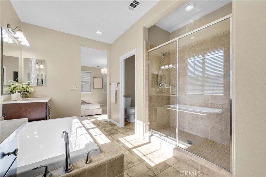 3515 Gardenia Lane Brea, CA 92823 - Photo 25 of 46 a spacious bathroom with a shower sink and mirror