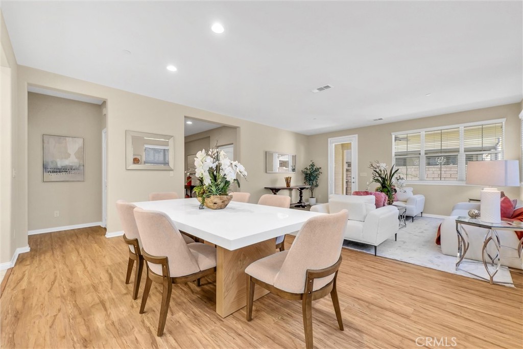 3515 Gardenia Lane Brea, CA 92823 - Photo 7 of 46 a view of a dining room with furniture and wooden floor