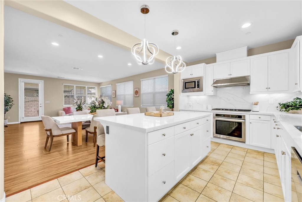 3515 Gardenia Lane Brea, CA 92823 - Photo 9 of 46 a kitchen with cabinets and chairs