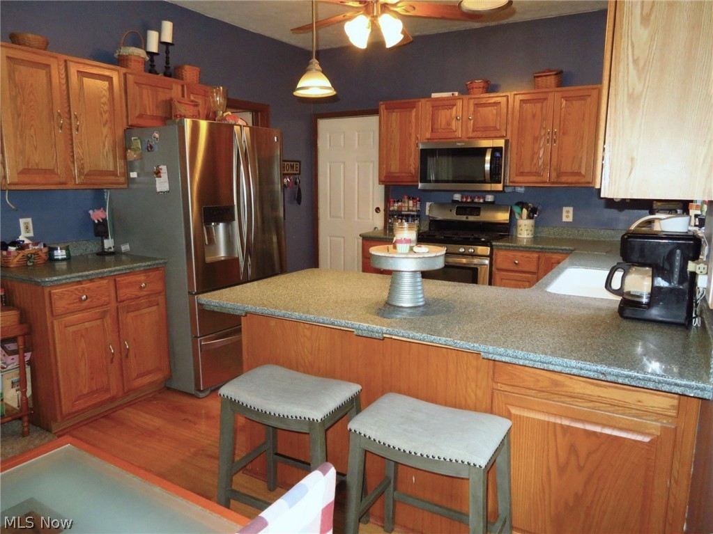 45295 Parsons Road Oberlin, OH 44074 - Photo 15 of 39 The two-stool breakfast bar is convenient for casual eating. Corian countertops, and stainless steel appliances can all stay