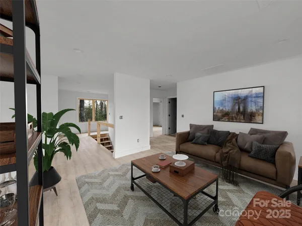a living room with furniture potted plant and a table