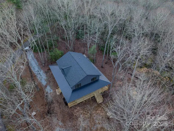 a wooden bench sitting in the middle of a forest