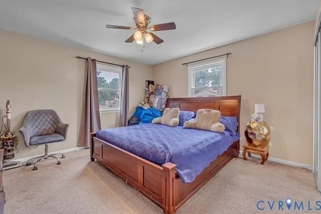 a bedroom with a bed and chair