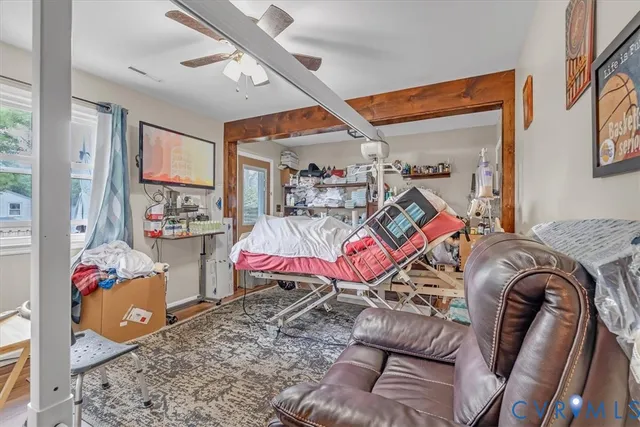 a bedroom with a bed and a couch